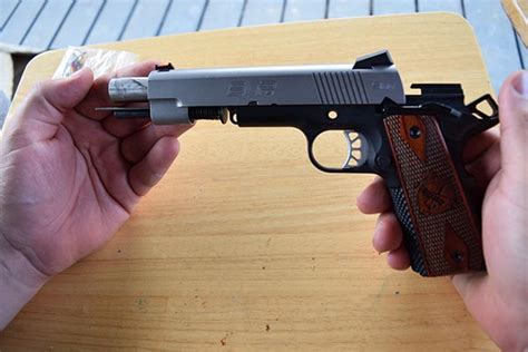 How to take apart 1911 - A good friend recently purchased this pistol and offered me the opportunity to do a video on it. We briefly go over the overt features such as the ambidextro...